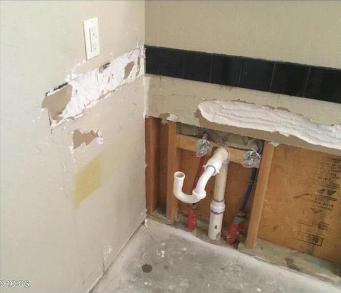 white pipe coming from the wall