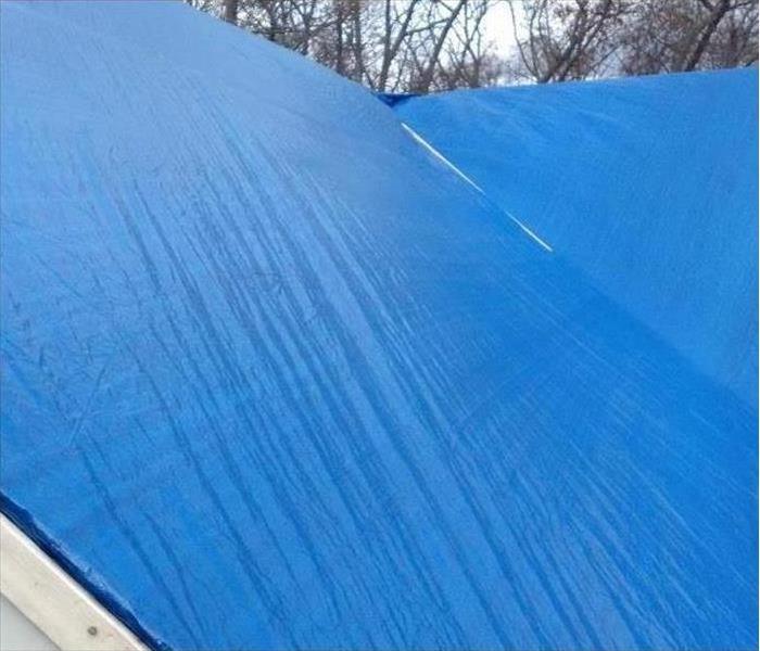 roof top tarped with blue tarp