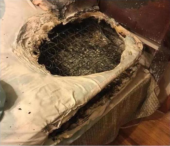 Mattress with a hole burn in it